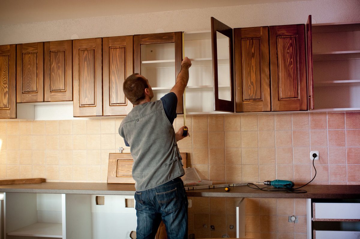 Professional Measuring Cabinets Prior to Refacing Them