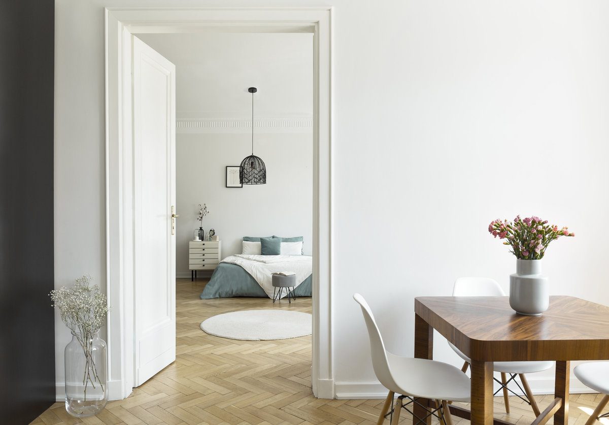 Beautiful House Interior With Vinyl Sheet Flooring, a Bedroom and a Wooden Table Beautiful House Interior With Vinyl Sheet Flooring, a Bedroom and a Wooden Table